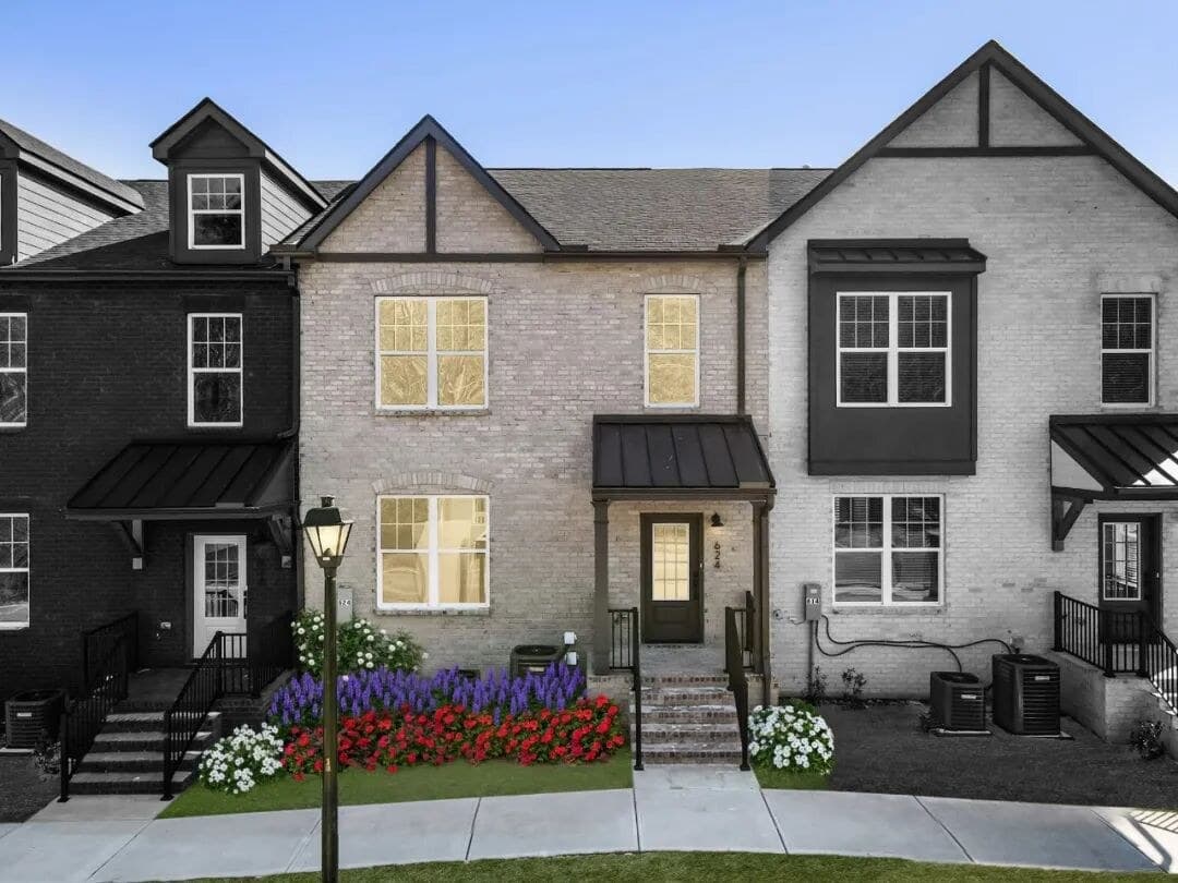 Completed townhomes — street view at dusk